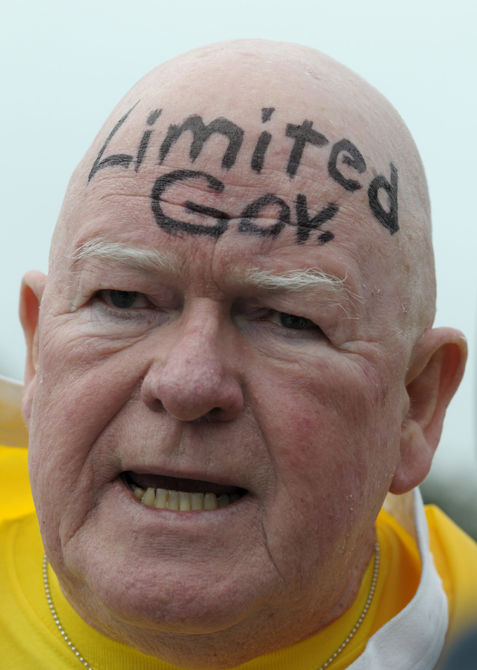 Bob Carey, 71, helps direct traffic before Gov. Rick Scott announced his budget during a Tea Party event in Eustis, Fla., Monday, Feb. 7, 2011.  (AP Photo/Phelan M. Ebenhack) (AP)