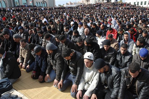 Tunisian demonstrators pray near the Prime Minister's office as they stage a protest calling for the resignation of Tunisia's Prime Minister Mohamed Ghannouchi in Tunis, Friday, Feb. 25, 2011. (AP Photo/Salah Habibi) (AP)