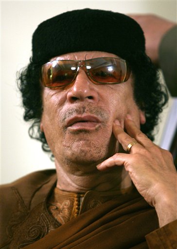 FILE.- This Friday, March 2, 2007 file photo shows Libya's Moammar Gadhafi  in Sabha, Libya Friday, March 2, 2007. Hundreds of Libyans calling for the government's ouster took to the streets early Wednesday in the country's second-largest city as Egypt-inspired unrest spread to the country long ruled by Moammar Gadhafi. (AP Photo/Nasser Nasser) (AP)
