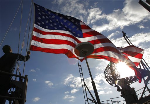 FILE - In this Dec. 10, 2010 file photo, a U.S. Navy crew hoists the Stars and Stripes on the USS George Washington during "Keen Sword" U.S.-Japan joint military exercise over the Pacific Ocean. Further U.S.-Japan drills are being held late January through early February in Japan. Even as American and Chinese leaders talked up the need for closer ties in two high-profile visits this month, the U.S. and its Asian allies are quietly boosting their defenses.(AP Photo/Itsuo Inouye, File) (AP)