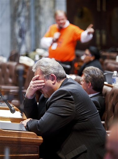 Wisconsin Rep. Mark Honadel, R-South Milwaukee, rubs his eyes during the 23rd hour of debate in the Assembly at the state Capitol in Madison, Wis., Wednesday, Feb. 23, 2011. Opponents to the governor's bill to eliminate collective bargaining rights for many state workers are on their ninth day of protests at the Capitol. (AP Photo/Andy Manis) (AP)