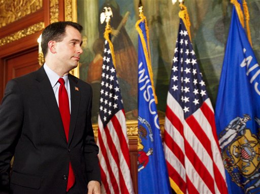 Wisconsin Gov. Scott Walker walks away after talking to the media at the state Capitol in Madison, Wis., Monday, Feb. 21, 2011. Opponents to the governor's bill to eliminate collective bargaining rights for many state workers are in the 7th day of protests at the Capitol. (AP Photo/Andy Manis) (AP)