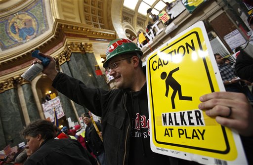 Union steam fitter Andrew Williams of West Allis, Wis., uses an air horn during protest at the state Capitol in Madison, Wis., Friday, Feb. 25, 2011, over the governor's proposed budget. Protests to the governor's bill to eliminate collective bargaining rights for many state workers are in their 11th day at the Capitol. (AP Photo/Andy Manis) (AP)