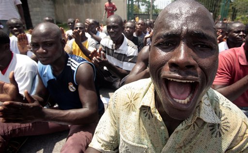 Youths supporting sitting president Laurent Gbagbo receive military style training in Abidjan, Ivory Coast, Wednesday, March 23, 2011. The Ivorian leader refusing to cede power has warned international journalists that they would be considered accomplices to terrorists if they don't do a more balanced job of reporting the country's political crisis. In a statement read on state television, Ahoua Don Mello, a spokesman for sitting president Laurent Gbagbo, accused journalists of fabricating last week's shelling of civilians in an Abidjan neighborhood. (AP Photo/Emanuel Ekra) (AP)