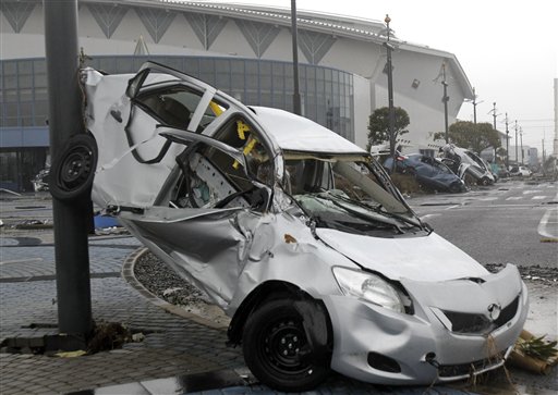 Wreckage of Toyota Yaris compact sedans, export model for North America destroyed by the March 11 earthquake and tsunami, remain at a Sendai port, Japan, Tuesday, March 15, 2011. (AP Photo/Koji Sasahara) (AP)