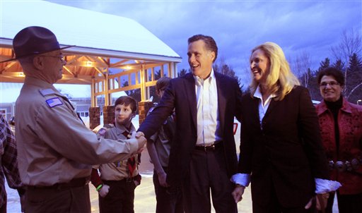 Former Massachusetts Gov. Mitt Romney, center, and his wife, Ann, are greeted Saturday, March 5, 2011, in Bartlett, N.H. Romney was the keynote speaker at the Carroll County Republican Committee Lincoln Day Dinner. (AP Photo/Jim Cole) (AP)
