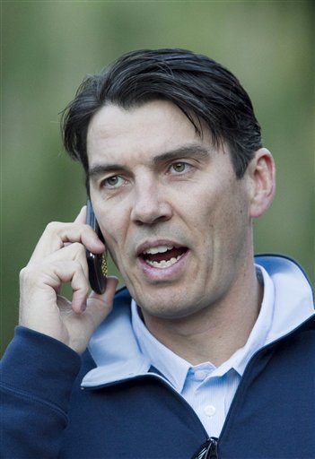 FILE - In this July 8, 2010 file photo, AOL Chairman and CEO Tim Armstrong talks on the phone as he walks to a morning session at the annual Allen & Co. media summit in Sun Valley, Idaho. Online company AOL Inc. is buying online news hub Huffington Post Monday, Feb. 7, 2011, in a $315 million deal that represents a bold bet on the future of online news.(AP Photo/Nati Harnik) (AP)