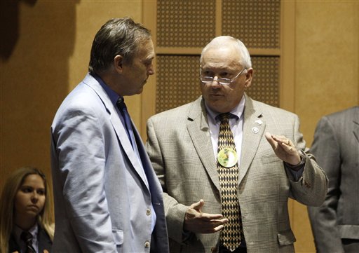 Proponents of the new Arizona immigration bills Sen. Andy Biggs, R-Gilbert, left, listens to Sen. Russell Pearce, R-Mesa, as the latest series of Arizona immigration-related bills are debated on the Senate floor at the Arizona Capitol Thursday, March 17, 2011, in Phoenix.  The Senate debates and plans on voting on the bills, the measures deal with citizenship, health care, public services and everyday activities ranging from hiring to driving. (AP Photo)  the latest series of Arizona immigration-related bills on the Senate floor at the Arizona Capitol Thursday, March 17, 2011, in Phoenix.  The Senate debates and plans on voting on the bills, the measures deal with citizenship, health care, public services and everyday activities ranging from hiring to driving. (AP Photo) (AP)