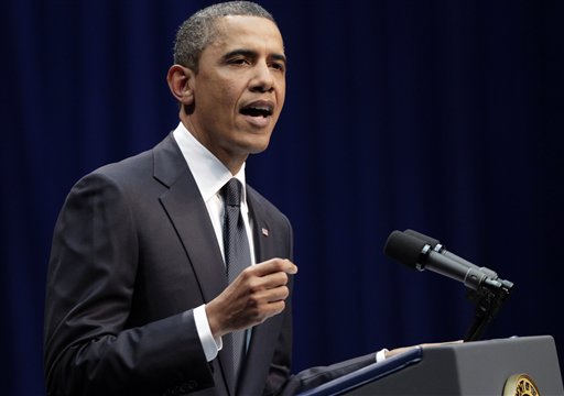 President Barack Obama speaks at a memorial service for the victims of Saturday's shootings at McKale Center on the University of Arizona campus Wednesday, Jan. 12, 2011, in Tucson, Ariz.  (AP Photo/J. Scott Applewhite) (AP)
