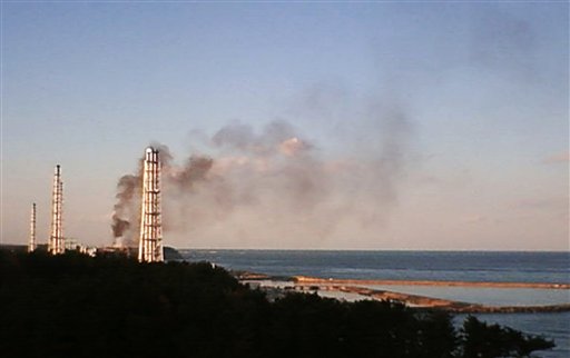 In this photo from a footage of a live camera released by Tokyo Electric Power Co. (TEPCO), black smoke billows from the crippled Fukushima Dai-ichi nuclear power plant in Okumamachi, northeastern Japan,Tuesday, March 22, 2011. (AP Photo/Tokyo Electric Power Co. via Kyodo News) EDITORIAL USE ONLY (AP)