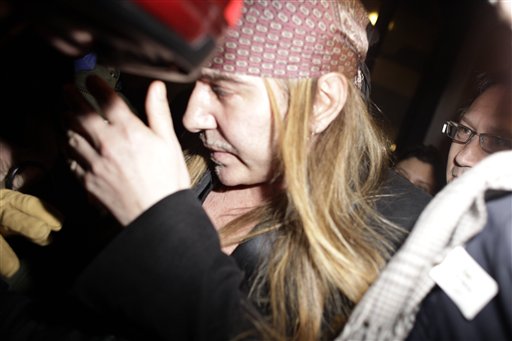 Fashion designer John Galliano, leaves a police station,  in Paris, Monday, Feb. 28, 2011. Galliano arrived Monday at a Paris police station to face accusations that he made illegal anti-Semitic slurs, hours after a video emerged of the famed fashion designer praising Adolf Hitler. The Gibraltar-born designer, wearing a wide-brimmed black hat, made no comment to reporters as he entered to face claims by a couple that he made an anti-Semitic remark during a dispute at a trendy Paris cafe. (AP Photo/Thibault Camus) (AP)