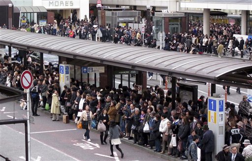 CORRECT COUNTRY CODE IN HEADER FIELD - Commuters wait in a long queue at a bus terminal outside Yokohama railway station in Yokohama, southwest of Tokyo, following a strong earthquake hit eastern Japan on Friday, March 11, 2011. (AP Photo/Shuji Kajiyama) (AP)