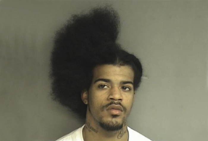 This Tuesday, March 8, 2011 booking photo released by the Stamford, Conn., Police shows David C. Davis, 21, of New Haven, Conn., who was arrested Tuesday and charged with slashing another man in the back while he was in the middle of a haircut.  (AP Photo/Stamford Police Department) (Anonymous)