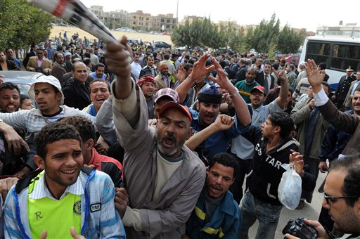 Egyptian protesters shout slogans as they gather to call for the trial of members of ousted President Hosni Mubarak in front of a court in Cairo, Egypt, Tuesday, March 8, 2011.  An Egyptian court on Tuesday rejected an appeal by ousted President Hosni Mubarak and his family against a top prosecutor's move to seize funds that could total in the billions of dollars. The decision clears the way for a criminal investigation and a possible trial of Egypt's ousted leader. (AP Photo/Hussam Ali) (AP)