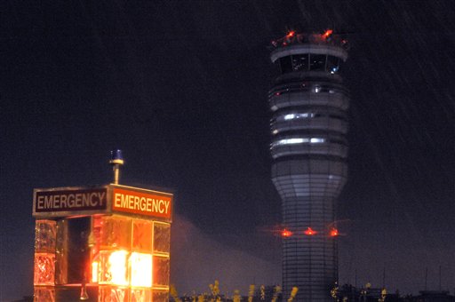 The FAA control tower at Reagan National Airport is seen during a storm, in Arlington, Va., Wednesday, March 23, 2011. Federal safety officials are investigating a report that two planes landed at the airport without control tower clearance because the air traffic controller was asleep. (AP Photo/Cliff Owen) (AP)