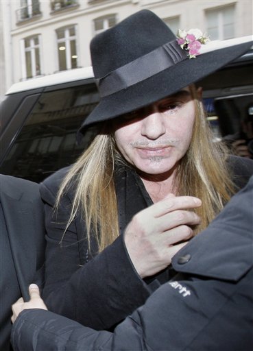 FILE - In this Monday, Feb. 28, 2011 file photo, Fashion designer John Galliano arrives at a police station in Paris. Christian Dior have fired Galliano  in wake of alleged anti-Semitic remarks he made during a dispute at a trendy Paris cafe. (AP Photo/Michel Euler, File) (AP)