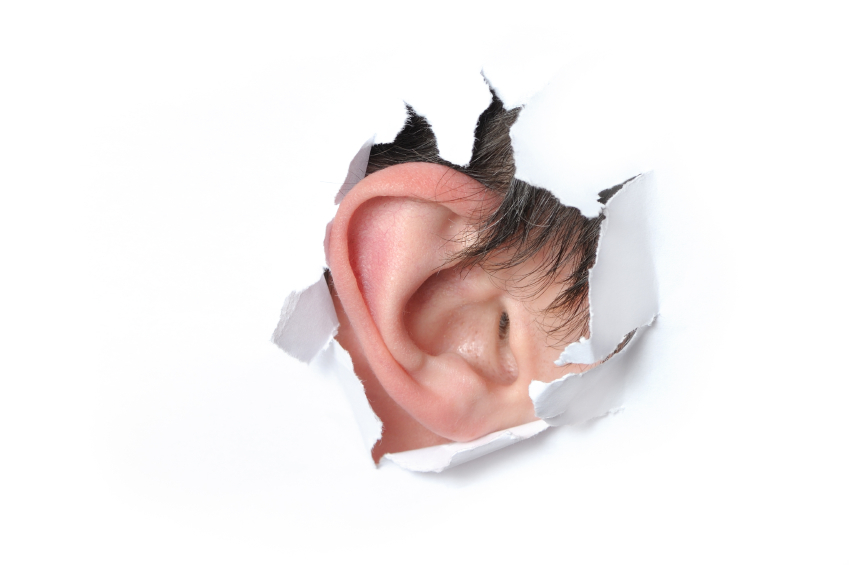 Ear in the hole of a paper (Igor Kovalchuk)
