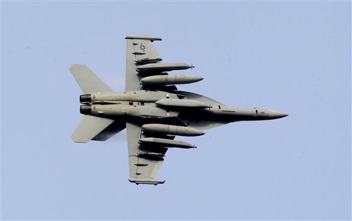 An F-18 growler jet fighter flies over the Nato airbase in Aviano, Italy, Saturday, March 19, 2011. NATO's top decision-making body is meeting in emergency session Saturday to review military plans for a no-fly zone over Libya. The North Atlantic Council is expected to issue the order to launch the operation during this weekend. Officials said the military staff was putting the final touches on plans to deploy dozens of fighter-bombers, tankers, helicopters and surveillance planes to several air bases along Europe's southern rim. (AP Photo/Luca Bruno) (AP)