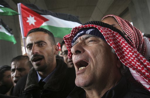 A Jordanian protester shouts slogans during a demonstration in Amman, Jordan Thursday, March 24, 2011. Hundreds of Jordanians, mostly university students or unemployed graduates unaffiliated with any political party, set up a protest camp in a main square in the capital on Thursday to press demands for the ouster of the prime minister and wider public freedoms. (AP Photo/Nader Daoud) (AP)