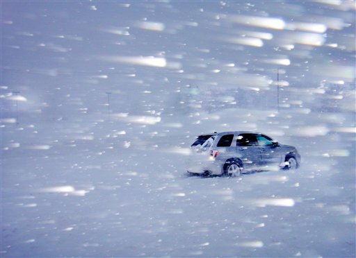 Heavy snow is blown by high winds along Highway 13 near Burnsville, Minn. Sunday, Feb. 20, 2011. Heavy snow and high winds  southern Minnesota caused scores of accidents, grounded hundreds of flights and forced some businesses to close early.  (AP Photo/The Star Tribune, Brian Peterson)  MANDATORY CREDIT; ST. PAUL PIONEER PRESS OUT; MAGS OUT; TWIN CITIES TV OUT (AP)
