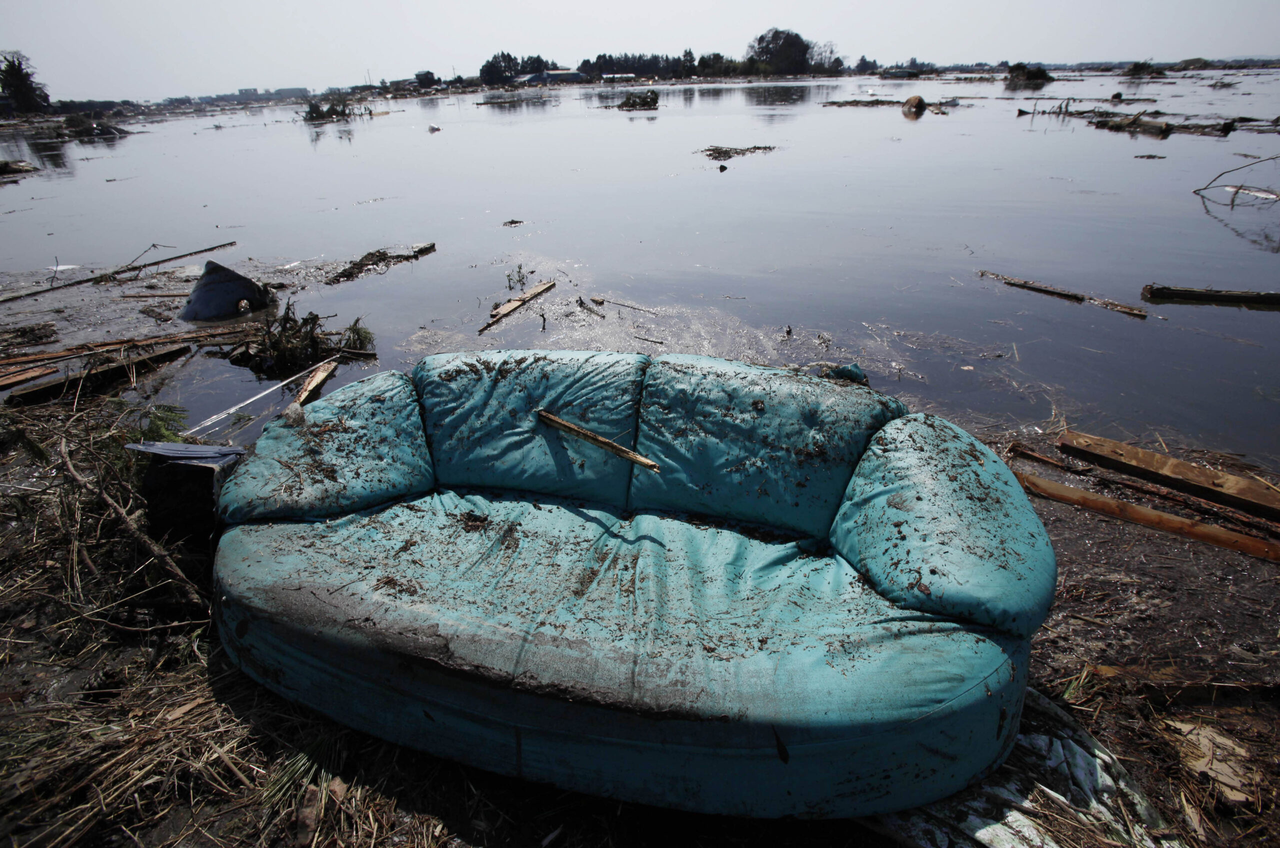 A sofa remains on the rice paddy hit by   tsunami following last Friday's earthquake in Sendai, Miyagi Prefecture, Sunday, March 13, 2011. (AP Photo/Shuji Kajiyama) (Shuji Kajiyama)