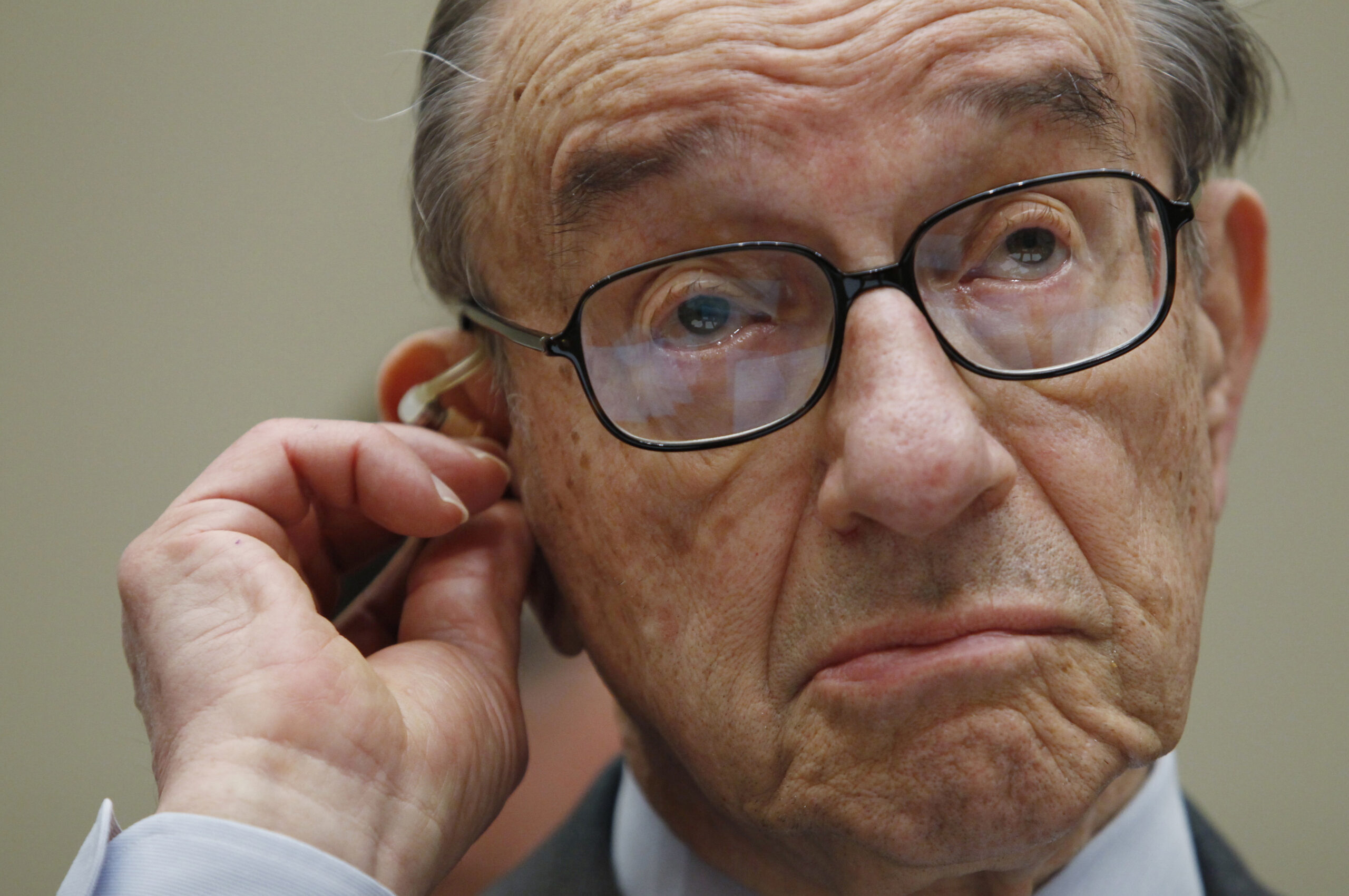 Former Federal Reserve Board chairman Alan Greenspan listens to opening statements as he testifies before the Financial Crisis Inquiry Commission hearing on Capitol Hill in Washington, April 7 , 2010. Making it easier for poorer Americans to get mortgages didn't push the country into crisis but Wall Street's drive to package the loans into opaque securities helped do so, Greenspan said on Wednesday.     REUTERS/Kevin Lamarque  (UNITED STATES - Tags: POLITICS BUSINESS IMAGES OF THE DAY) (Â© Kevin Lamarque / Reuters)