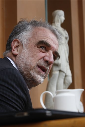 Luis Moreno Ocampo, the Prosecutor of the International Criminal Court (ICC) , talks during in interview with the Associated Press in Cairo, Egypt, Thursday, March 24, 2011. Ocampo says that he is "100 percent" certain that his investigation will lead to charges of crimes against humanity against the Libyan regime of Moammar Gadhafi. (AP Photo/Amr Nabil) (AP)