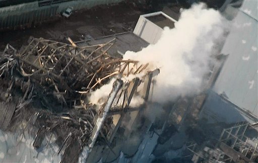 In this photo taken Wednesday, March 16, 2011 and released by Tokyo Electric Power Co. via Kyodo News Friday, smoke billows from wrecked unit 3 at Japan's crippled Fukushima Dai-ichi nuclear power plant in Okumamachi, Fukushima Prefecture. Emergency crews worked to reconnect electricity to cooling systems and spray more water on overheating nuclear fuel at the tsunami-ravaged facility Friday. (AP Photo/Tokyo Electric Power Co. via Kyodo News)  JAPAN OUT, MANDATORY CREDIT, NO LICENSING IN CHINA, HONG KONG, JAPAN, SOUTH KOREA AND FRANCE (AP)