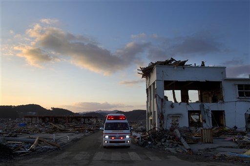 A Japanese ambulance drives through the earthquake and tsunami-hit town of Minamisanriku, Friday, March 18, 2011.  (AP Photo/David Guttenfelder) (AP)