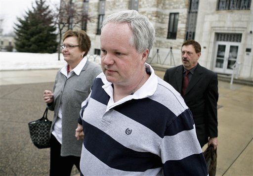 FILE - In this Feb. 17, 2011 file photo, William Melchert-Dinkel, center, leaves the Rice County Courthouse in Faribault, Minn., with his attorney Terry Watkins, right, and wife, Joyce Melchert-Dinkel, after waiving his right to a jury trial. Melchert-Dinkel, 48, of Faribault, was found guilty Tuesday, March 15, 2011 of aiding the suicides of 18-year-old Kajouji of Brampton, Ontario, who jumped into a river in 2008, and 32-year-old Mark Drybrough of Coventry, England, who hung himself in 2005. (AP Photo/Robb Long, File) (AP)