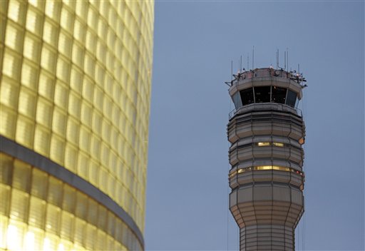 The FAA control tower at Reagan National Airport is seen in Arlington, Wednesday, March 23, 2011. Federal safety officials are investigating a report that two planes landed at the airport without control tower clearance because the air traffic controller was asleep. (AP Photo/Cliff Owen) (AP)