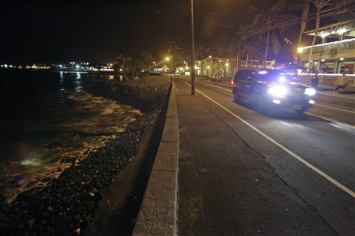 A police car drives along empty Ali'i Drive in Kailua-Kona, Hawaii, Thursday, March 10, 2011.  A tsunami warning following an earthquake in Japan forced the evacuation of coastal areas of the island. Tsunami waves spawned by a massive earthquake in Japan have hit Hawaii early Friday. The Pacific Tsunami Warning Center says Kauai was the first island hit by the tsunami, which was quickly sweeping through the Hawaiian Island chain. Officials predicted Hawaii would experience waves up to 6 feet.  (AP Photo/Chris Stewart) (AP)
