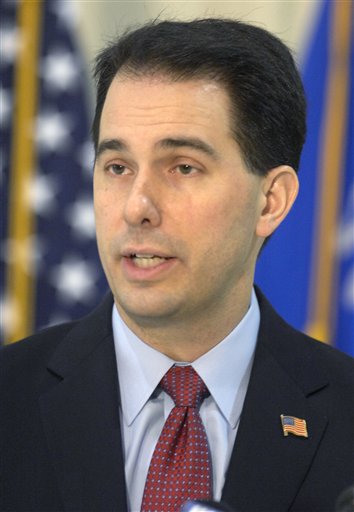 Gov. Scott Walker discusses his budget repair bill during a news conference at the Kenosha Airport in Kenosha, Wis., Friday, Feb. 25, 2011. Walker called on the missing Democratic state senators, including Kenosha's Robert Wirch, to return to the Capitol. (AP Photo/The Journal Times, Mark Hertzberg) (AP)