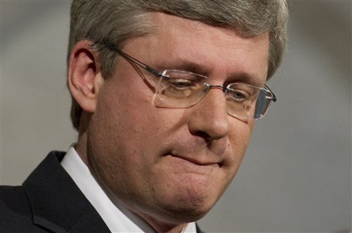 Prime Minister Stephen Harper speaks with the media outside the House of Commons on Parliament Hill in Ottawa, Canada on Wednesday March 23, 2011.  Canada's three opposition parties said Wednesday they planned to topple the conservative government in a vote of no confidence in Parliament this week and trigger the country's fourth election in seven years. Prime Minister Stephen Harper needs the support of at least one opposition party to stay in power, but all three rejected Harper's proposed budget after it was announced Tuesday. (AP Photo/The Canadian Press, Sean Kilpatrick) (AP)
