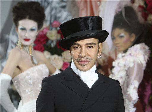 FILE - In this Jan. 25, 2010 file photo, fashion designer John Galliano poses at the end of the presentation of the Dior Haute Couture spring/summer 2010 fashion collection in Paris. Christian Dior said Tuesday, March 1, 2011, that Galliano has been immediately laid off, just days after he was suspended as its creative director pending an investigation into an alleged anti-Semitic incident in a Paris cafe last week.(AP Photo/Jacques Brinon) (AP)