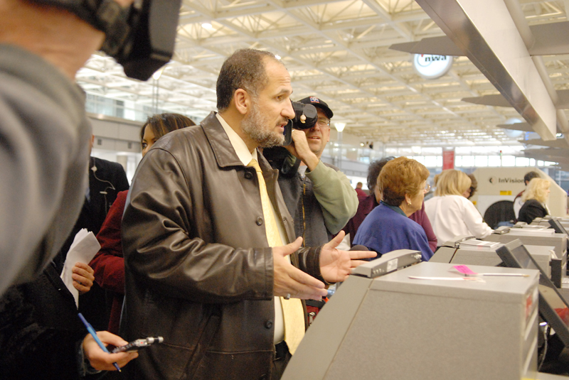 Omar Shahin, one of six imams removed from a US Airways flight at the Minnepolis-St. Paul International Airport, waits at the Northwest counter, where he successfully purchased a ticket on Nov. 21, 2006.