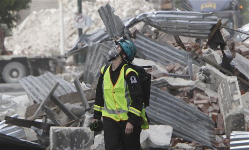 A New Zealand Urban Search and Rescue worker walks through the central business district during a search of earthquake damaged buildings in Christchurch, New Zealand, Wednesday, March 2, 2011. Police said the death toll from the quake had reached 158 and was expected to rise further following the Feb. 22. 2011, 6.3 magnitude temblor. Around 200 people are listed as missing.  (AP Photo/Mark Baker, Pool) (AP)
