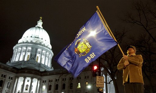 Union supporter Stanley Minnick of Madison, Wis., protests outside of the the state Capitol in Madison, Wis., Thursday morning March 10, 2011, in opposition to the governor's proposed budget to eliminate collective bargaining rights for many state workers. (AP Photo/Andy Manis) (AP)