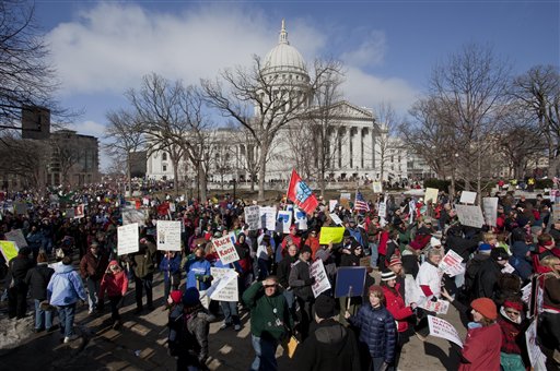 Thousands of pro-labor protesters rallied at the Wisconsin Capitol Saturday, March 12, 2011, in Madison, Wis., vowing to fight back after the state's Republican governor signed into law a controversial bill that eliminates most union rights for public employees.(AP Photo/Morry Gash) (AP)