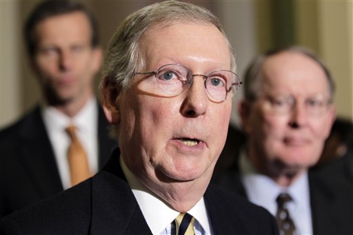 Senate Republican leader, Mitch McConnell of Kentucky, speaks with reporters following a weekly Republican policy luncheon, on Capitol Hill in Washington, Tuesday, March 8, 2011. He is joined at right by Sen. Lamar Alexander, R-Tenn., and at left by Sen. John Thune, R-S.D. (AP Photo/J. Scott Applewhite) (AP)