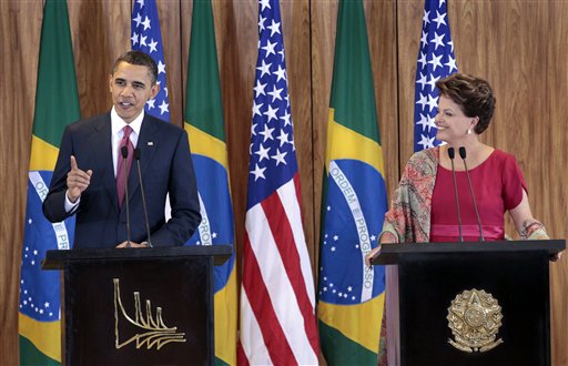 U.S. President Barack Obama, left, with Brazilian President Dilma Vana Rousseff, right, during their joint news conference at the Palacio do Planalto in Brasilia, Brazil, Saturday, March 19, 2011. Obama welcomed Brazil's rise as an economic power and said the United States would be an eager customer for its oil exports as he opened a Latin America tour against the backdrop of an escalating Western military showdown with Libya's Moammar Gadhafi.  (AP Photo/Pablo Martinez Monsivais) (AP)