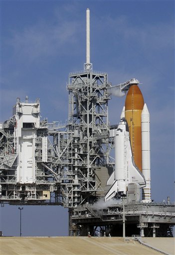 Fuel is loaded into the space shuttle Discovery as she sits on the launch pad at the Kennedy Space Center in Cape Canaveral, Fla., Thursday, Feb. 24, 2011. Discovery and her crew of six astronauts are scheduled to lift off this afternoon on an 11-day mission to the international space station. (AP Photo/John Raoux) (AP)