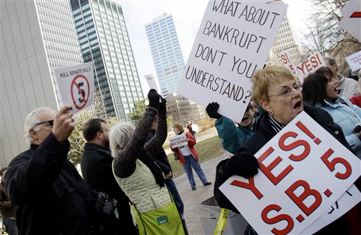 Both supporters and opponents of Senate Bill 5 demonstrate outside the Ohio Statehouse Wednesday, March 2, 2011, in Columbus, Ohio. The vote for Senate Bill 5 is scheduled for later today and, if passed, would strip public employees of collective bargaining rights. (AP Photo/Jay LaPrete) (AP)