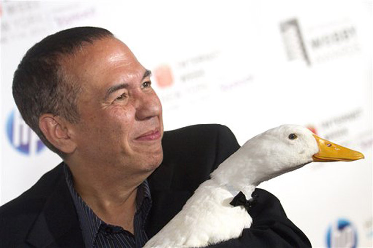 Gilbert Gottfried arrives with the Aflac Duck to the 14th Annual Webby Awards in New York, Monday, June 14, 2010. (AP Photo/Charles Sykes) (Charles Sykes)