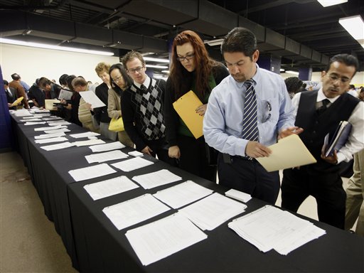 Participants wait in line at a  Job Fair Thursday, Feb 24, 2011, sponsored by Best Jobs Magazine and the National Employment Council at Angels Stadium in Anaheim, Calif. The economy grew more slowly at the end of last year than first thought as state and local governments cut spending more deeply and Americans spent a tad less briskly.(AP Photo/Nick Ut) (AP)
