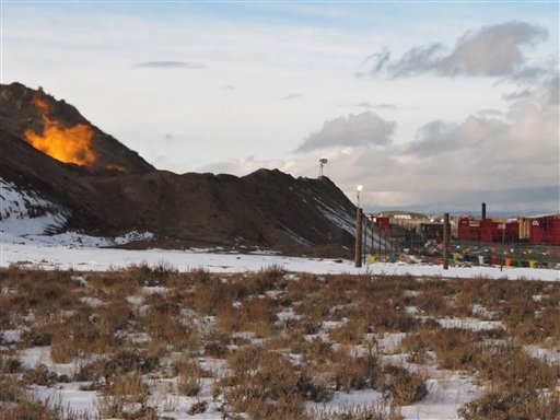 A small fire flares in western Wyoming's Upper Green River Basin in this Jan. 22, 2010 photo.  Ozone levels last week in this same region exceeded the worst days in major U.S. cities last year. Local residents complain of runny eyes, nosebleeds and shortness of breath and say the air is hazy.