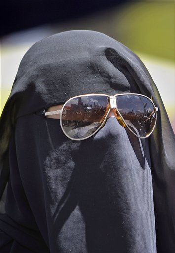 A female anti-government protestor takes part in a  demonstration demanding the resignation of Yemeni President Ali Abdullah Saleh, in Sanaa,Yemen, Thursday, March 24, 2011. The leader of Yemen's largest tribe has announced his support for opposition demands that the country's longtime president step down. Sheik Sinan Abu Lohoum of the Baqeel tribe is also warning President Ali Abdullah Saleh against further use of violence against protesters.(AP Photo/Muhammed Muheisen) (AP)