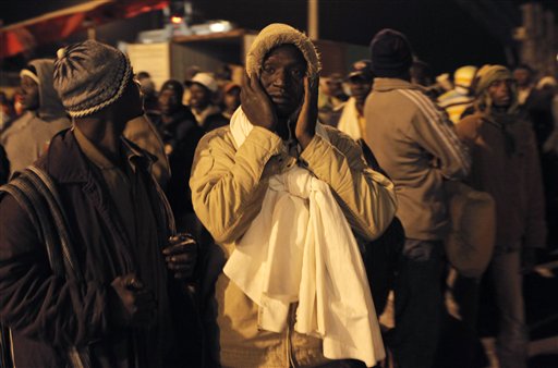 A stranded foreign refugee reacts after being informed that his name is not on the passengers list as a ship evacuating wounded Libyans and refugees fleeing conflict zone is scheduled to leave the port of Misrata, Libya Wednesday, April 20, 2011. Inside the besieged city of Misrata, spent rockets protrude from the pavement of a parking lot, unarmed teenagers prepare plastic crates of Molotov cocktails, and fighters at roadblocks sit inside empty shipping containers outfitted with furniture, carpets and generator-powered TVs and watch Al-Jazeera reports of their war with Moammar Gadhafi. (AP Photo/Nasser Nasser) (AP)
