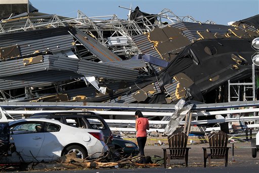 Annina Purdy, who was inside the Lowe's hardware store in Sanford, N.C. the previous day when a tornado destroyed the building, returned to the store's parking lot on Sunday, April 17, 2011, to reclaim personal belongings from her car. (AP Photo/Ted Richardson) (AP)