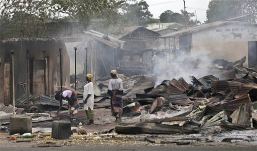 Women look for useful goods at the burned Zonkwa Market  in Kaduna, Nigeria, Thursday, April 21, 2011.  Nigerian officials on Thursday delayed next week's gubernatorial elections in two predominantly Muslim northern states that have been wracked by deadly riots and retaliatory violence since the presidential election was won by a Christian from the country's south.  (AP Photo/Sunday Alamba) (AP)